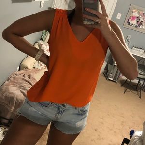 Orange flowy blouse